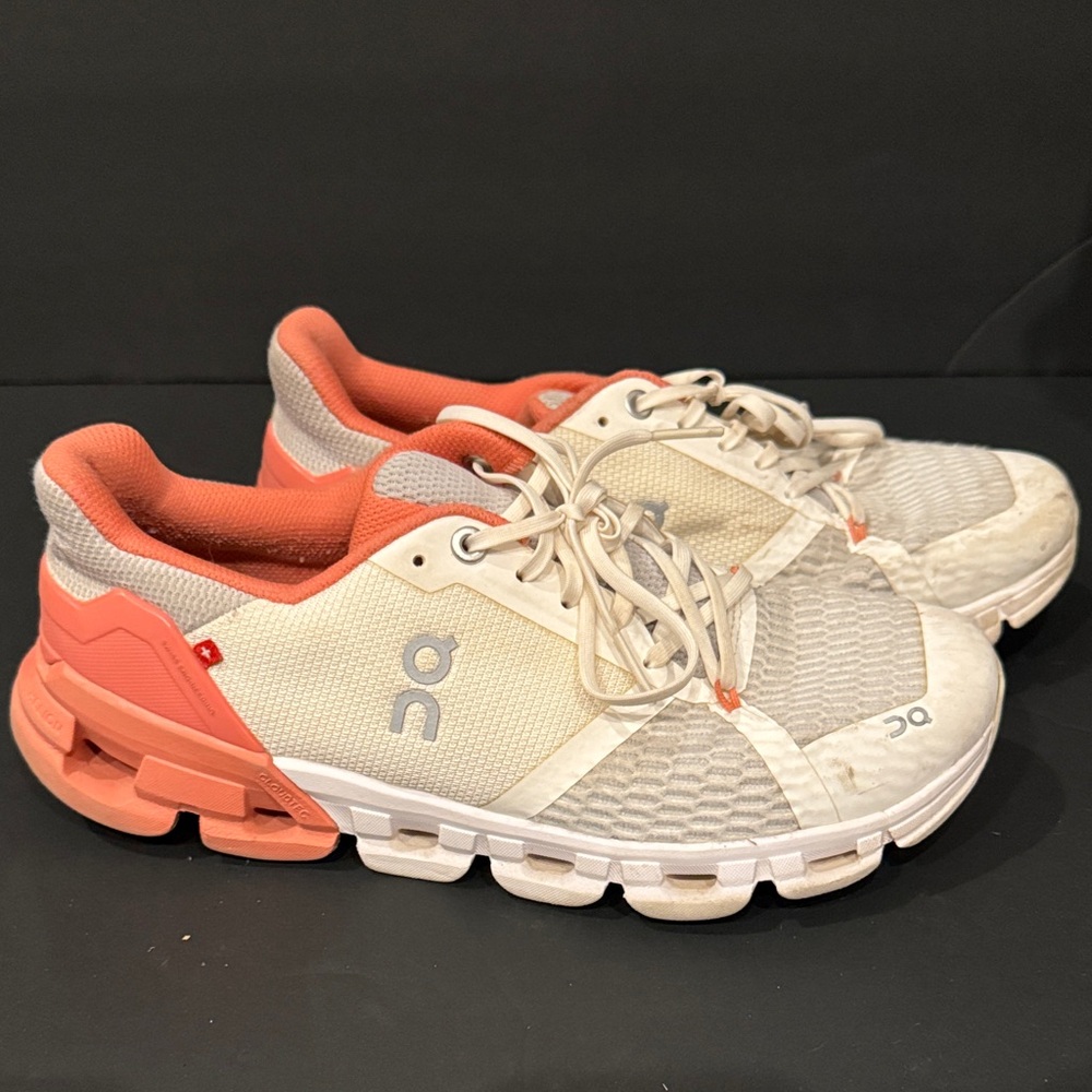 On Running White and Orange Sneakers